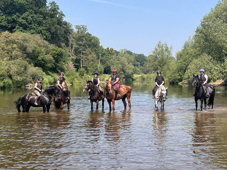 On horseback in the river Severn
