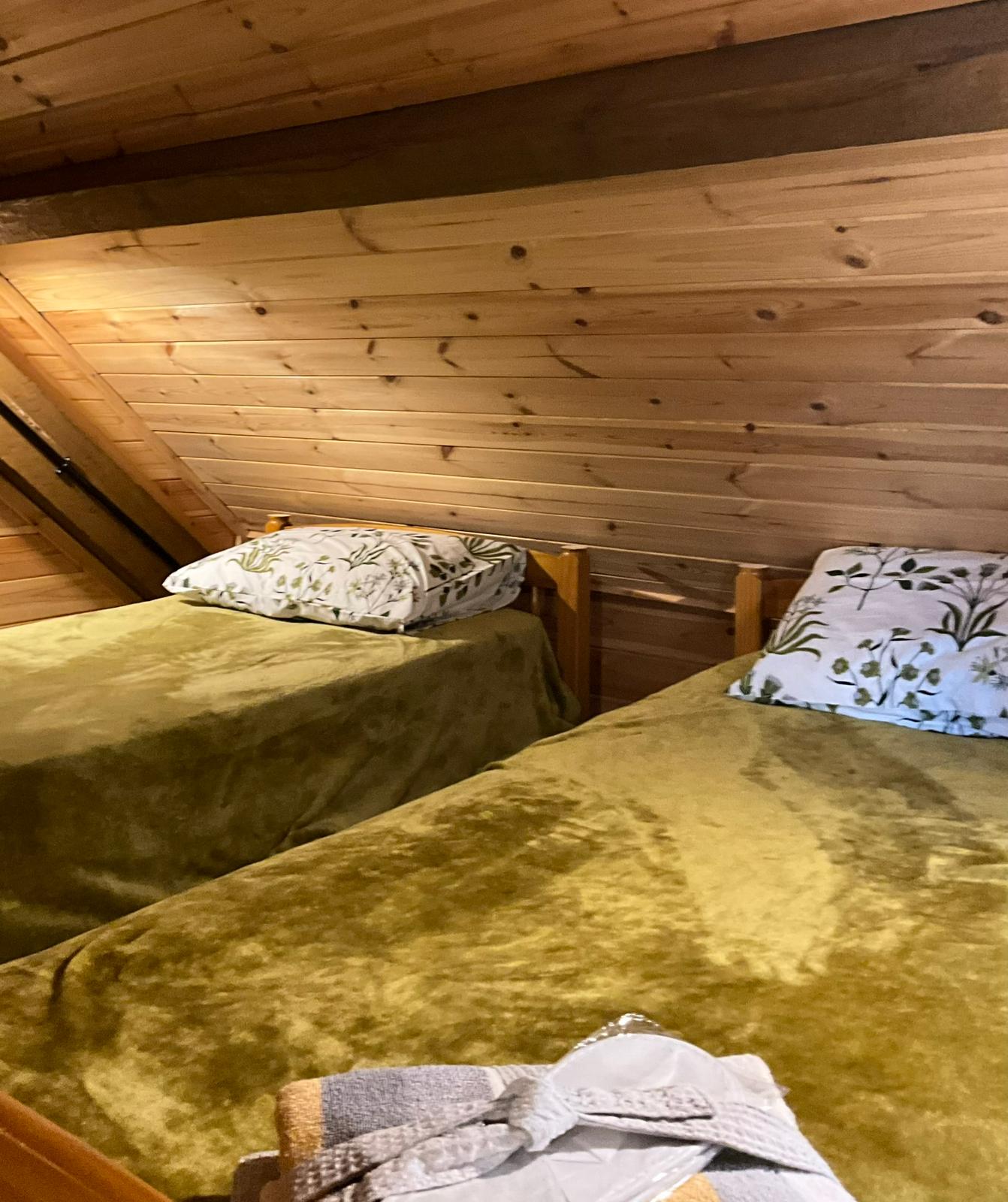 Two single beds in the glamping lodge