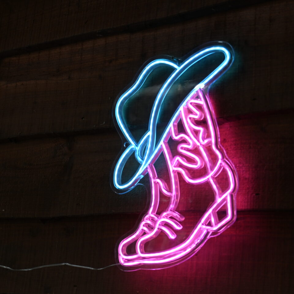 neon cowboy light at bank farm