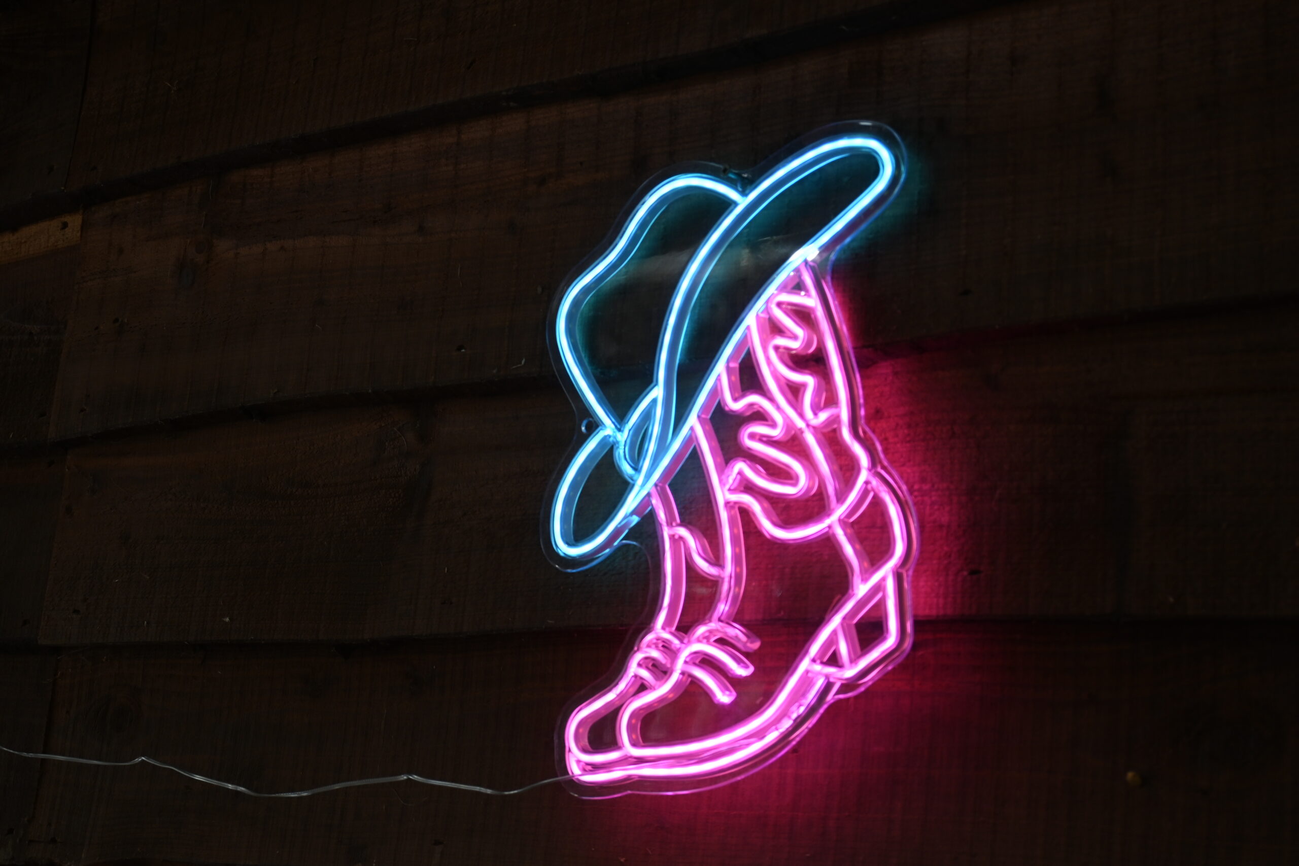 neon cowboy light at bank farm