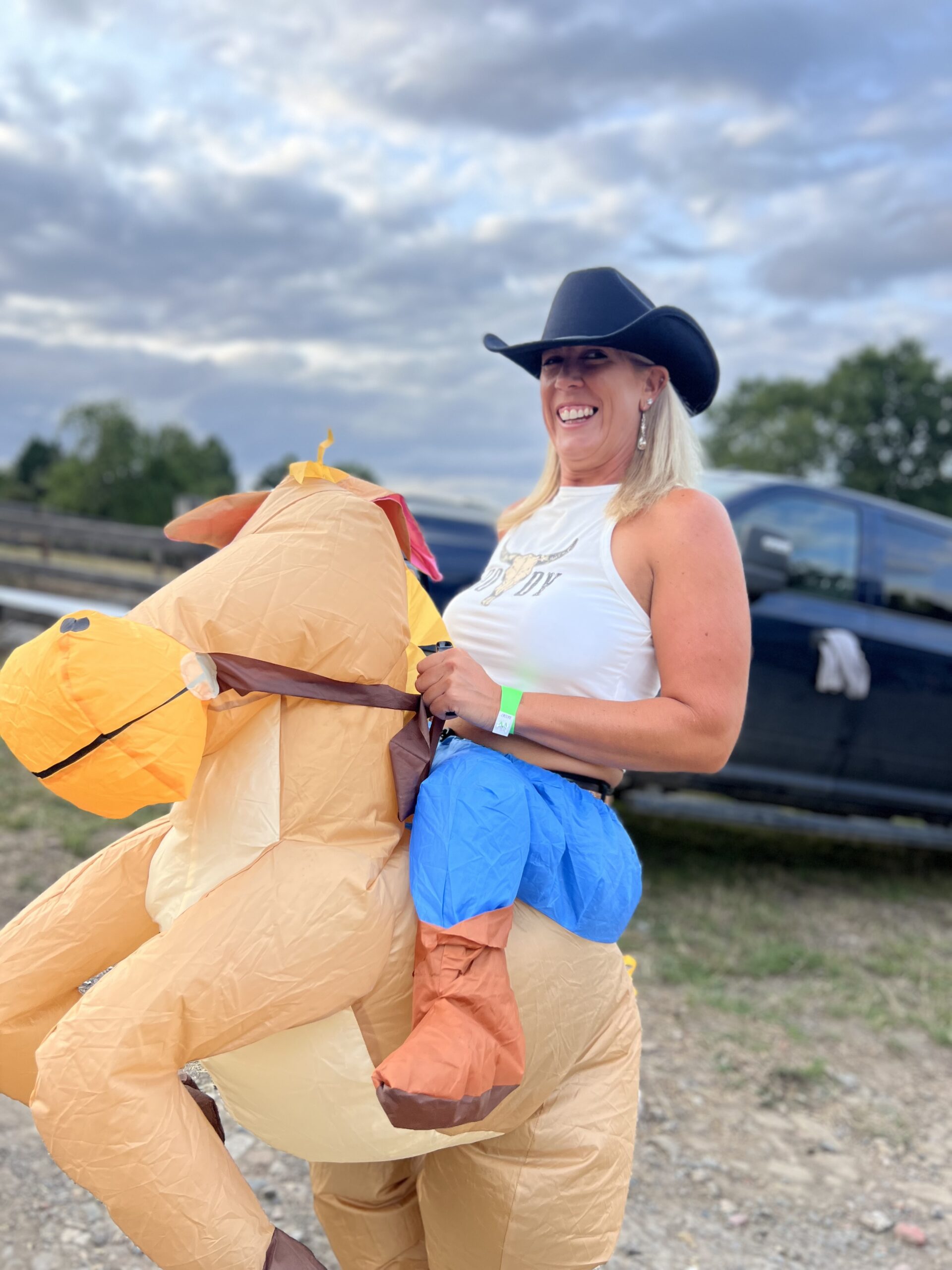 hen party goer in inflatable horse fancy dress