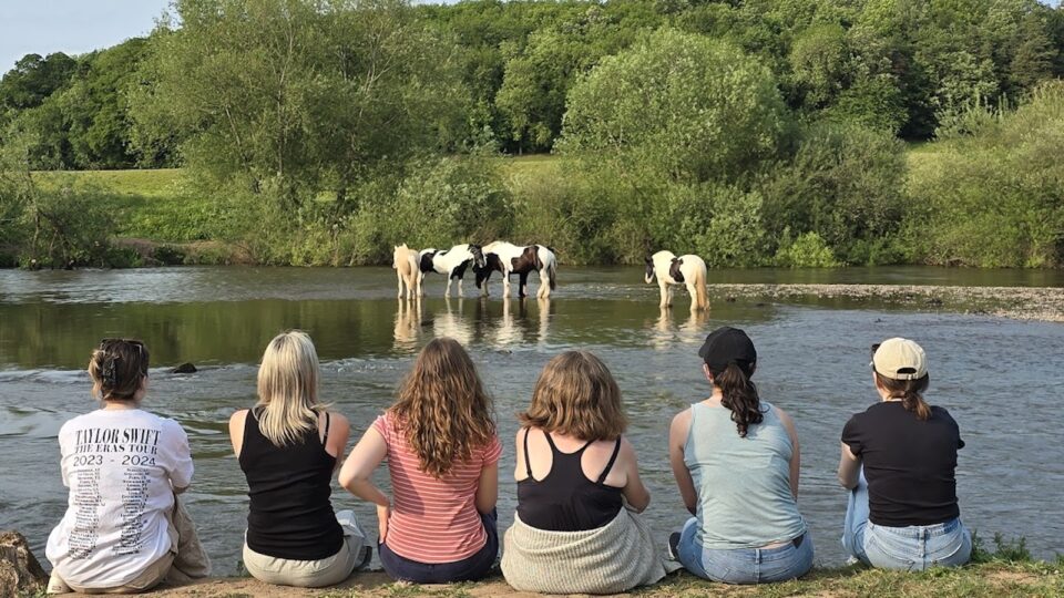 Girls on river bank