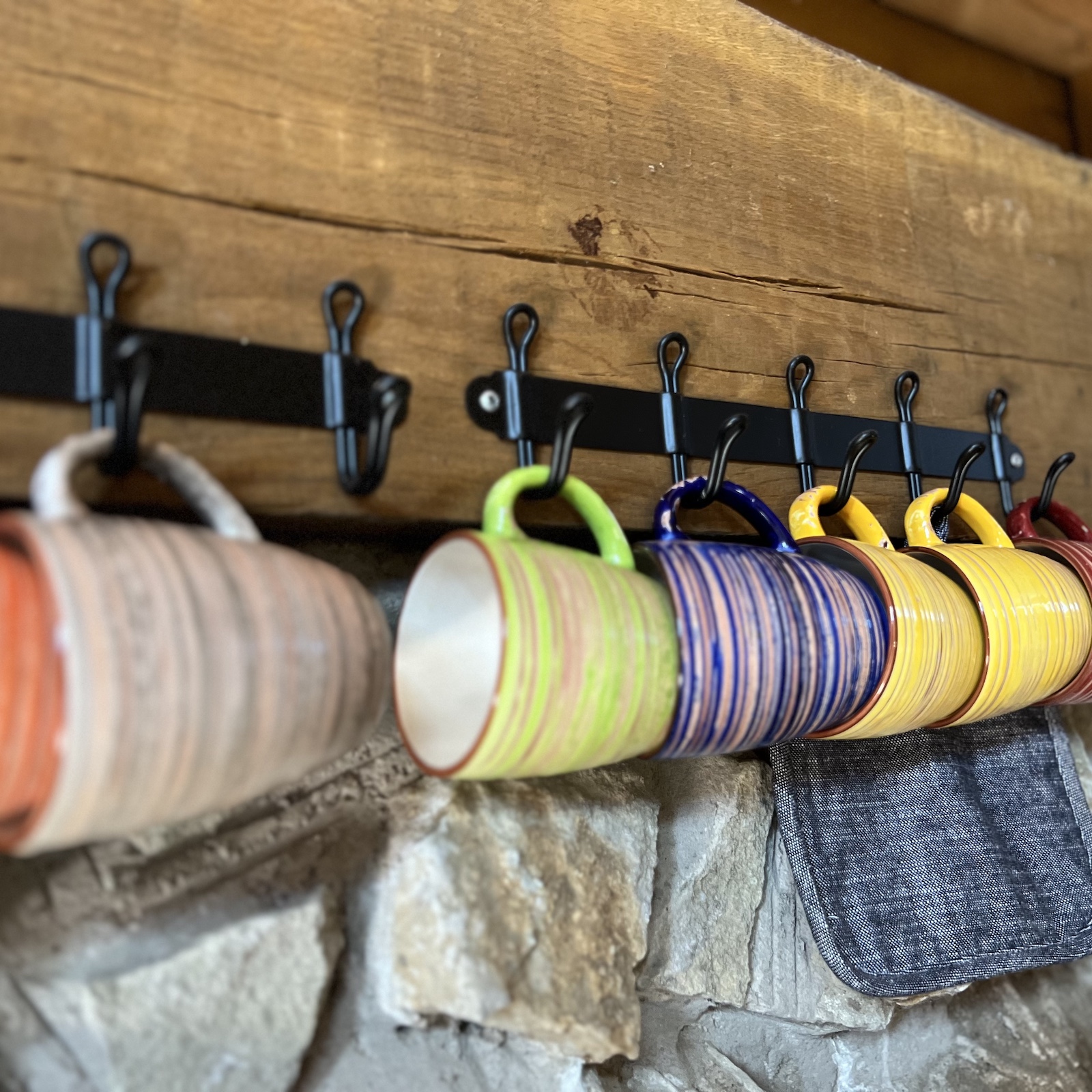 mugs hanging in glamping lodge
